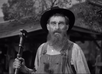 Movie still from “Sergeant York” (1941), directed by Howard Hawks – An old man with a long beard holding a hammer; Close Up shot, Low angle