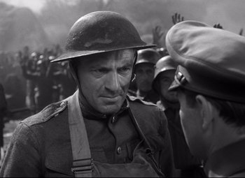 Movie still from “Sergeant York” (1941), directed by Howard Hawks – An old photo of a man in a military uniform; Medium shot, Over the shoulder angle