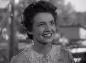 Movie still from “Sergeant York” (1941), directed by Howard Hawks – An old black and white photo of a woman smiling; Close Up shot, Low angle