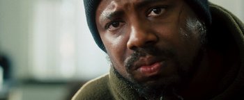 Movie still from “Set It Off” (1996), directed by F. Gary Gray – A person wearing a hat; Close Up shot, Low angle