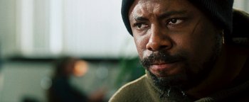 Movie still from “Set It Off” (1996), directed by F. Gary Gray – A person with a beard; Close Up shot, Low angle