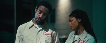 Movie still from “Set It Off” (1996), directed by F. Gary Gray – A man and a woman standing next to each other; Close Up shot, Low angle