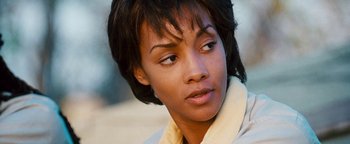 Movie still from “Set It Off” (1996), directed by F. Gary Gray – A person with short black hair; Close Up shot, High angle