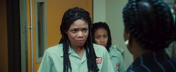 Movie still from “Set It Off” (1996), directed by F. Gary Gray – A woman with braids looking at a mirror; Close Up shot, Over the shoulder angle