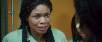 Movie still from “Set It Off” (1996), directed by F. Gary Gray – A woman with braids is looking at the camera; Close Up shot, Over the shoulder angle