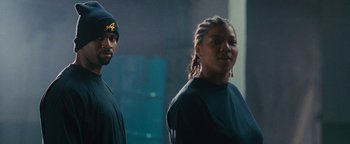 Movie still from “Set It Off” (1996), directed by F. Gary Gray – A man and a woman standing next to each other; Close Up shot, Low angle