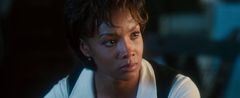 Movie still from “Set It Off” (1996), directed by F. Gary Gray – A person with short hair; Close Up shot, Over the shoulder angle