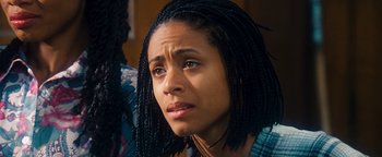 Movie still from “Set It Off” (1996), directed by F. Gary Gray – A person with long braids; Close Up shot, High angle
