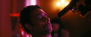 Movie still from “Set It Off” (1996), directed by F. Gary Gray – A person with a microphone; Close Up shot, Low angle