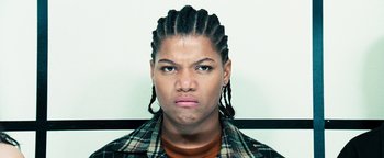 Movie still from “Set It Off” (1996), directed by F. Gary Gray – A man with dreadlocks and a plaid shirt; Close Up shot, Low angle