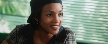 Movie still from “Set It Off” (1996), directed by F. Gary Gray – A person wearing a hat; Close Up shot, Over the shoulder angle