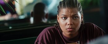 Movie still from “Set It Off” (1996), directed by F. Gary Gray – A person sitting in a car; Close Up shot, Low angle