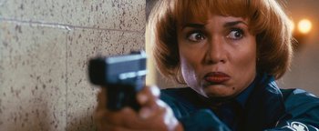 Movie still from “Set It Off” (1996), directed by F. Gary Gray – A person holding a gun; Close Up shot, Low angle