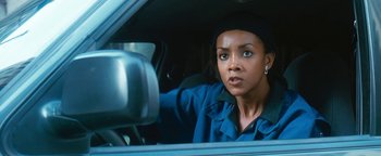 Movie still from “Set It Off” (1996), directed by F. Gary Gray – A woman sitting in the driver's seat of a car; Close Up shot, Low angle
