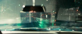 Movie still from “Set It Off” (1996), directed by F. Gary Gray – A view from a car window of a street at night; Close Up shot, Over the shoulder angle