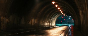Movie still from “Set It Off” (1996), directed by F. Gary Gray – An empty tunnel is lit up at night time; Extreme Wide shot, High angle