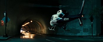 Movie still from “Set It Off” (1996), directed by F. Gary Gray – A police helicopter flying through a tunnel with lights on it; Wide shot, Low angle