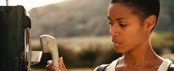 Movie still from “Set It Off” (1996), directed by F. Gary Gray – A person looking at a cell phone; Close Up shot, Low angle