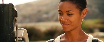Movie still from “Set It Off” (1996), directed by F. Gary Gray – A person wearing a white shirt; Close Up shot, Over the shoulder angle