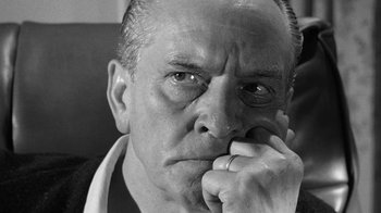 Movie still from “Seven Days in May” (1964), directed by John Frankenheimer – An older man with a finger in his mouth; Close Up shot, Low angle