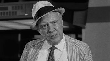 Movie still from “Seven Days in May” (1964), directed by John Frankenheimer – An older man wearing a hat and a suit; Close Up shot, Low angle