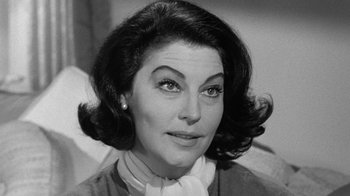 Movie still from “Seven Days in May” (1964), directed by John Frankenheimer – An old black and white photo of a woman; Close Up shot, High angle