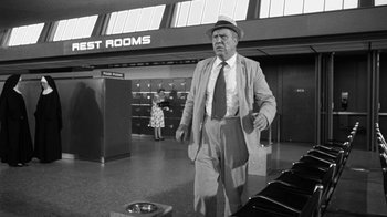 Movie still from “Seven Days in May” (1964), directed by John Frankenheimer – An older man wearing a hat and a suit; Medium shot, Low angle