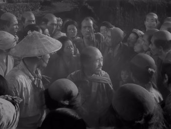 Movie still from “Seven Samurai” (1954), directed by Akira Kurosawa – A group of people gathered together in a room; Medium shot, High angle