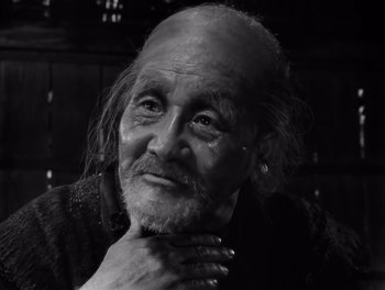 Movie still from “Seven Samurai” (1954), directed by Akira Kurosawa – An old man with a long beard and mustache; Close Up shot, Low angle