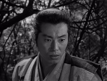 Movie still from “Seven Samurai” (1954), directed by Akira Kurosawa – A black and white photo of a man in a kimono; Close Up shot, Low angle