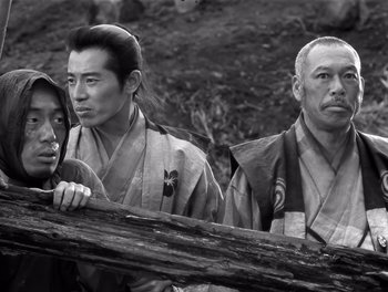 Movie still from “Seven Samurai” (1954), directed by Akira Kurosawa – A group of men standing next to each other; Medium shot, Low angle
