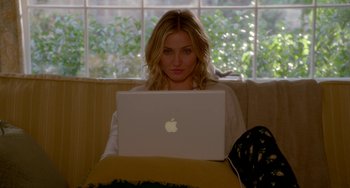 Movie still from “Sex Tape” (2014), directed by Jake Kasdan – A woman sitting in front of an apple laptop; Medium shot, High angle