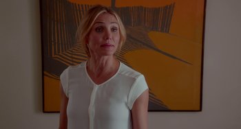 Movie still from “Sex Tape” (2014), directed by Jake Kasdan – A person standing in front of a painting; Medium shot, Over the shoulder angle