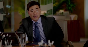 Movie still from “Sex Tape” (2014), directed by Jake Kasdan – A man sitting at a table in front of a glass of water; Medium shot, Over the shoulder angle