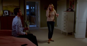 Movie still from “Sex Tape” (2014), directed by Jake Kasdan – A man and a woman are talking on a phone; Wide shot, High angle