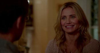 Movie still from “Sex Tape” (2014), directed by Jake Kasdan – A woman smiles brightly while sitting in front of a mirror; Close Up shot, Over the shoulder angle