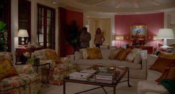 Movie still from “Sex Tape” (2014), directed by Jake Kasdan – Two people in a living room with couches and a coffee table; Wide shot, High angle