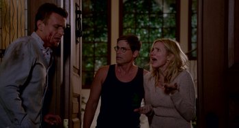 Movie still from “Sex Tape” (2014), directed by Jake Kasdan – A group of people standing next to each other in a room; Medium shot, Over the shoulder angle