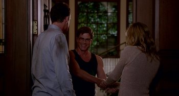 Movie still from “Sex Tape” (2014), directed by Jake Kasdan – Two men and a woman shaking hands in front of a window; Medium shot, Over the shoulder angle
