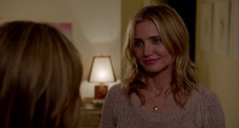 Movie still from “Sex Tape” (2014), directed by Jake Kasdan – A person wearing a sweater near a lamp; Close Up shot, Over the shoulder angle