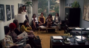 Movie still from “Shampoo” (1975), directed by Hal Ashby – A group of people sitting in a living room; Wide shot, High angle