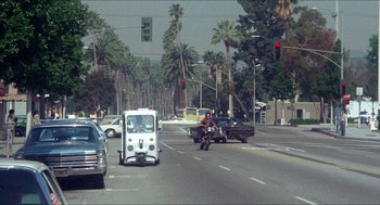 Movie still from “Shampoo” (1975), directed by Hal Ashby – Cars and a van are driving down the street; Extreme Wide shot, High angle