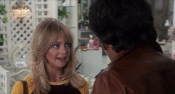 Movie still from “Shampoo” (1975), directed by Hal Ashby – A woman talking to a man wearing a leather jacket; Close Up shot, Over the shoulder angle