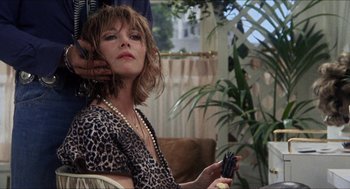 Movie still from “Shampoo” (1975), directed by Hal Ashby – A woman sitting in a chair with her hand on her shoulder; Close Up shot, Low angle