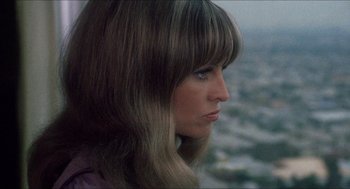 Movie still from “Shampoo” (1975), directed by Hal Ashby – A person with long blonde hair; Close Up shot, Low angle