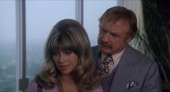 Movie still from “Shampoo” (1975), directed by Hal Ashby – A man and a woman standing next to each other in a room; Close Up shot, Over the shoulder angle