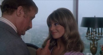 Movie still from “Shampoo” (1975), directed by Hal Ashby – A man and a woman looking at one another; Close Up shot, Over the shoulder angle