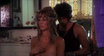 Movie still from “Shampoo” (1975), directed by Hal Ashby – A man and a woman are in a room; Close Up shot, Over the shoulder angle