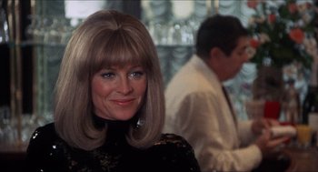 Movie still from “Shampoo” (1975), directed by Hal Ashby – A person wearing a wig; Close Up shot, Over the shoulder angle