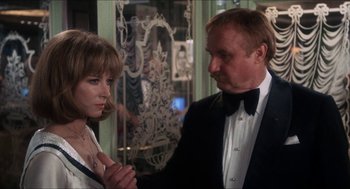 Movie still from “Shampoo” (1975), directed by Hal Ashby – A man and a woman standing next to each other in a room; Close Up shot, Over the shoulder angle